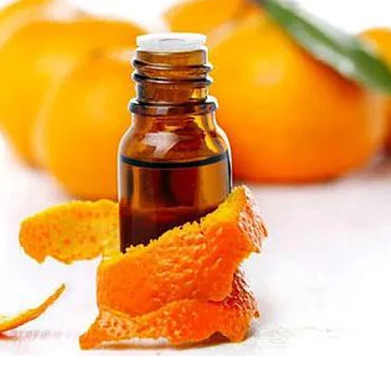 Distilled citrus oil in an amber bottle with citrus peel
