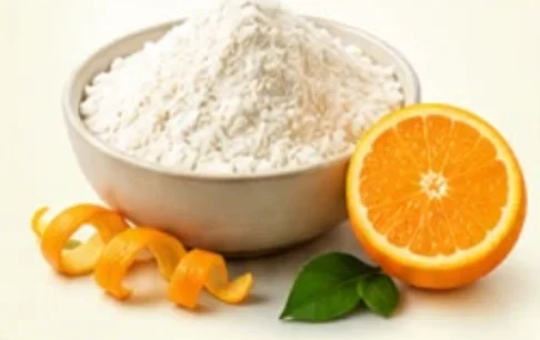 Citrus pectin powder in a bowl with fresh orange and peel